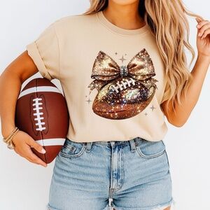 🏈 Sparkle & Spike: Gold Glitter Football Bow t-shirt. Touch down game ready